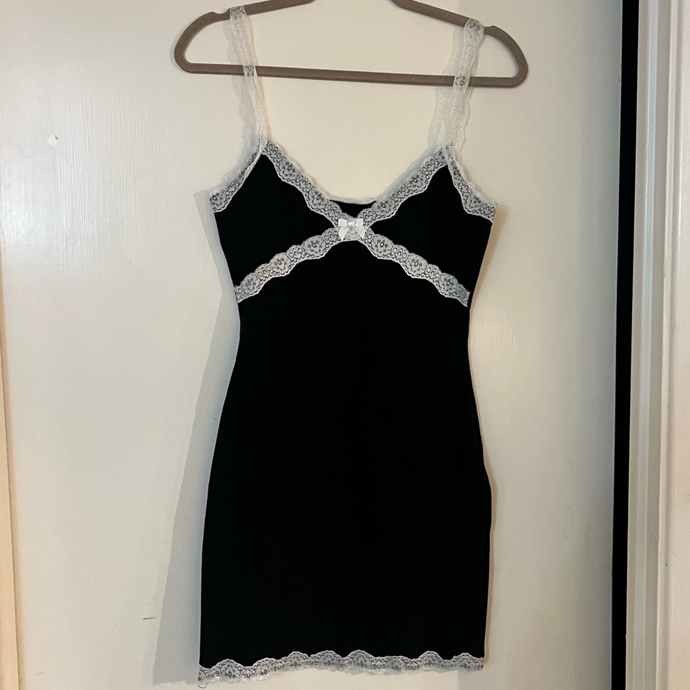 Black mini with lace straps and detail. Lace at bottom also.